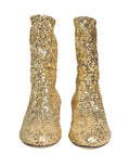 Bottes courtes dorées à sequins Dolce & Gabbana avec empeigne en stretch, style élégant et glamour, pour femmes.