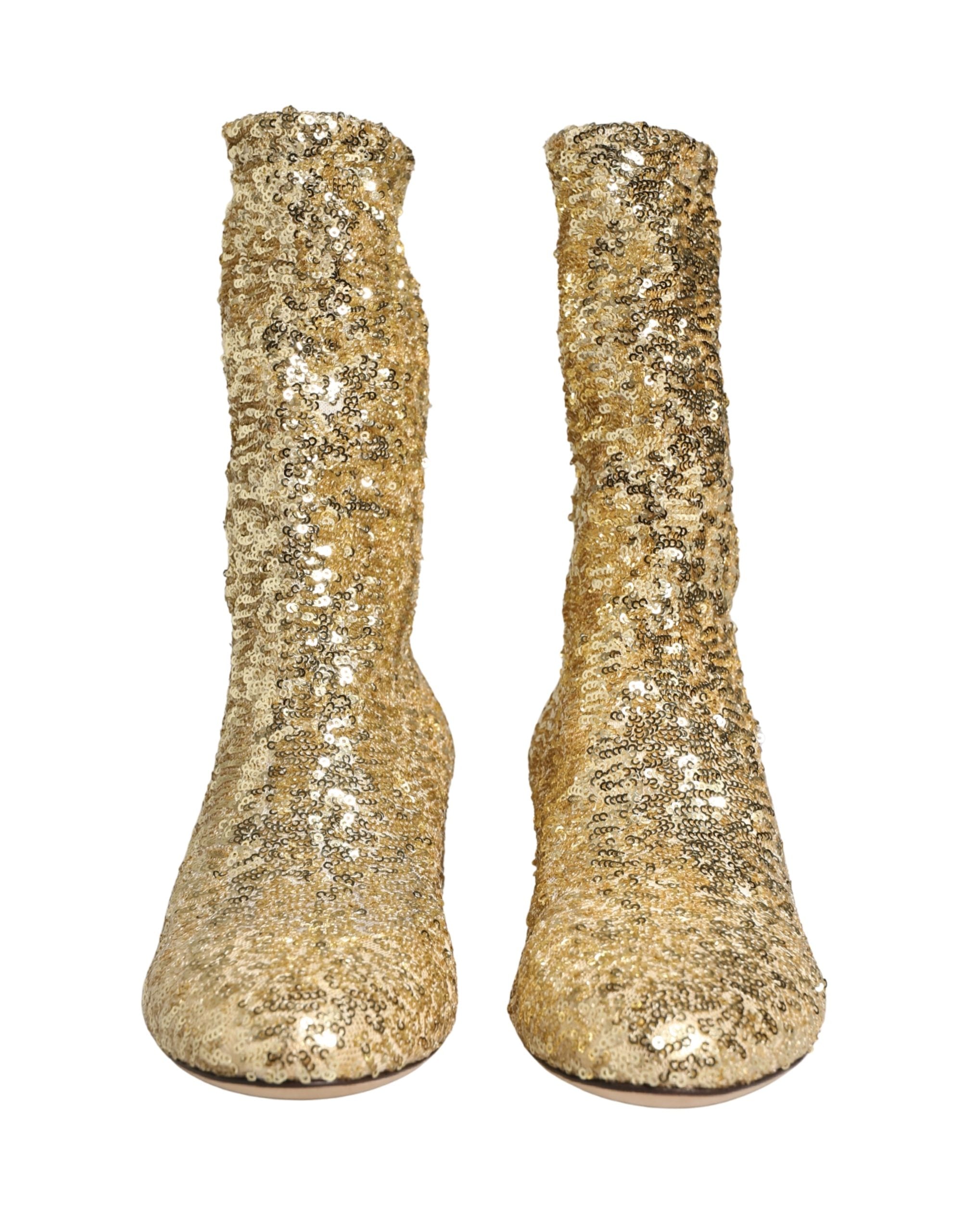 Bottes courtes dorées à sequins Dolce & Gabbana avec empeigne en stretch, style élégant et glamour, pour femmes.
