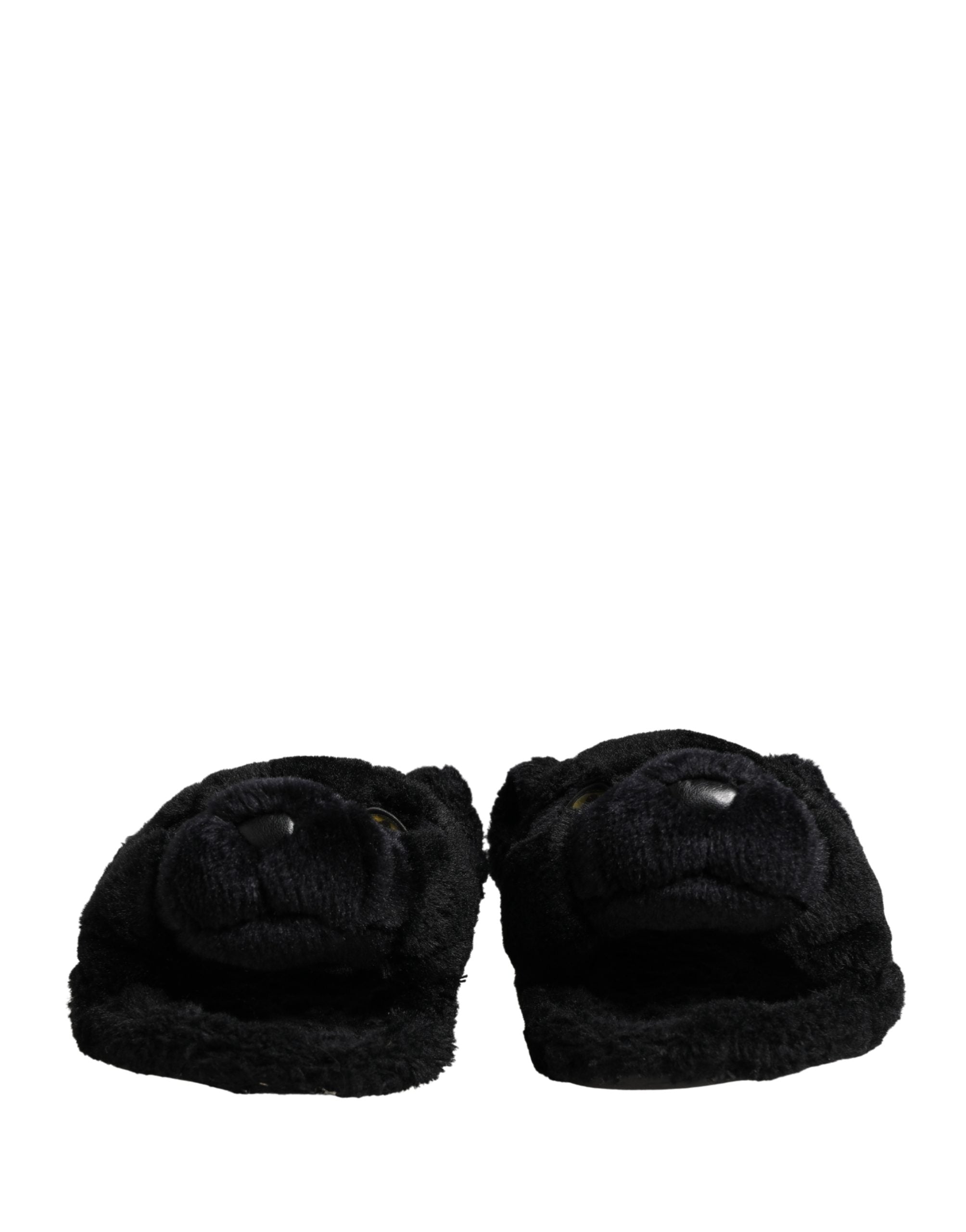 Sandales plates Dolce & Gabbana en fausse fourrure noire avec motif puma, chaussures confortables et élégantes.