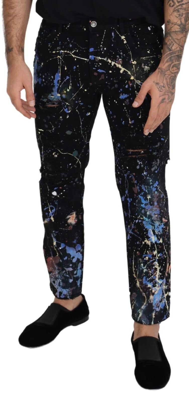 Jeans en denim noir Dolce & Gabbana avec imprimé éclaboussures de couleurs et coton, vue de face.