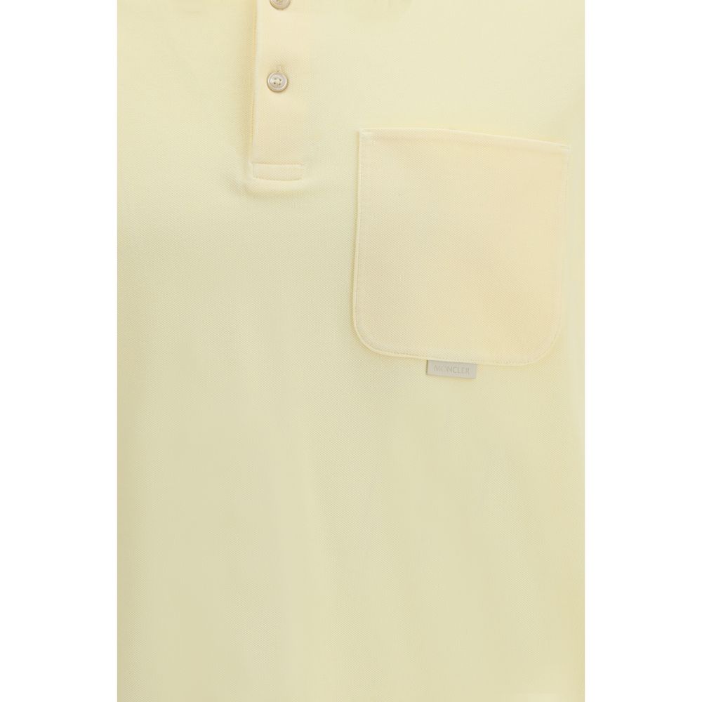 Chemise polo bicolore en coton Moncler, élégante et décontractée, avec col et boutons visibles.