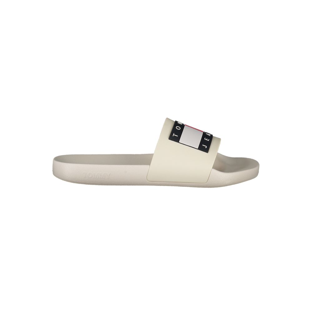 Pantoufles pour hommes Tommy Hilfiger en polyuréthane beige, confortables et élégantes, visibles sur l'image.
