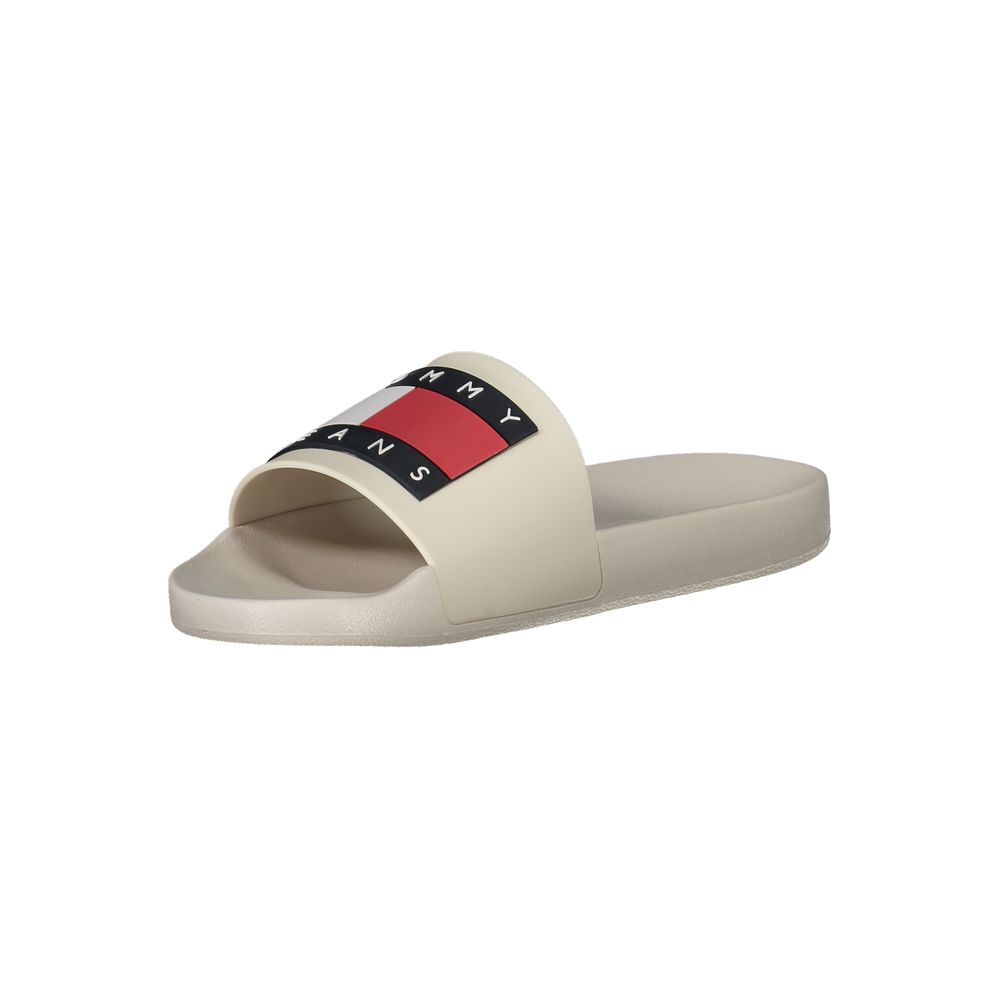 Mules pour hommes Tommy Hilfiger en polyuréthane beige, confortables et élégants, avec design simple et moderne.