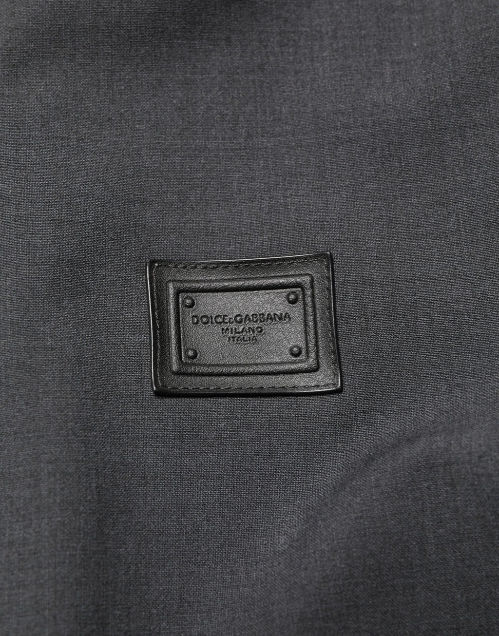 Veste bomber noire en laine pour homme de Dolce & Gabbana avec logo, fermeture éclair complète, style élégant et moderne.
