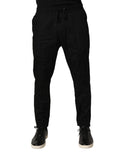 Pantalon jogging noir en coton Dolce & Gabbana pour homme, coupe skinny, avec ceinture élastique et poches latérales.