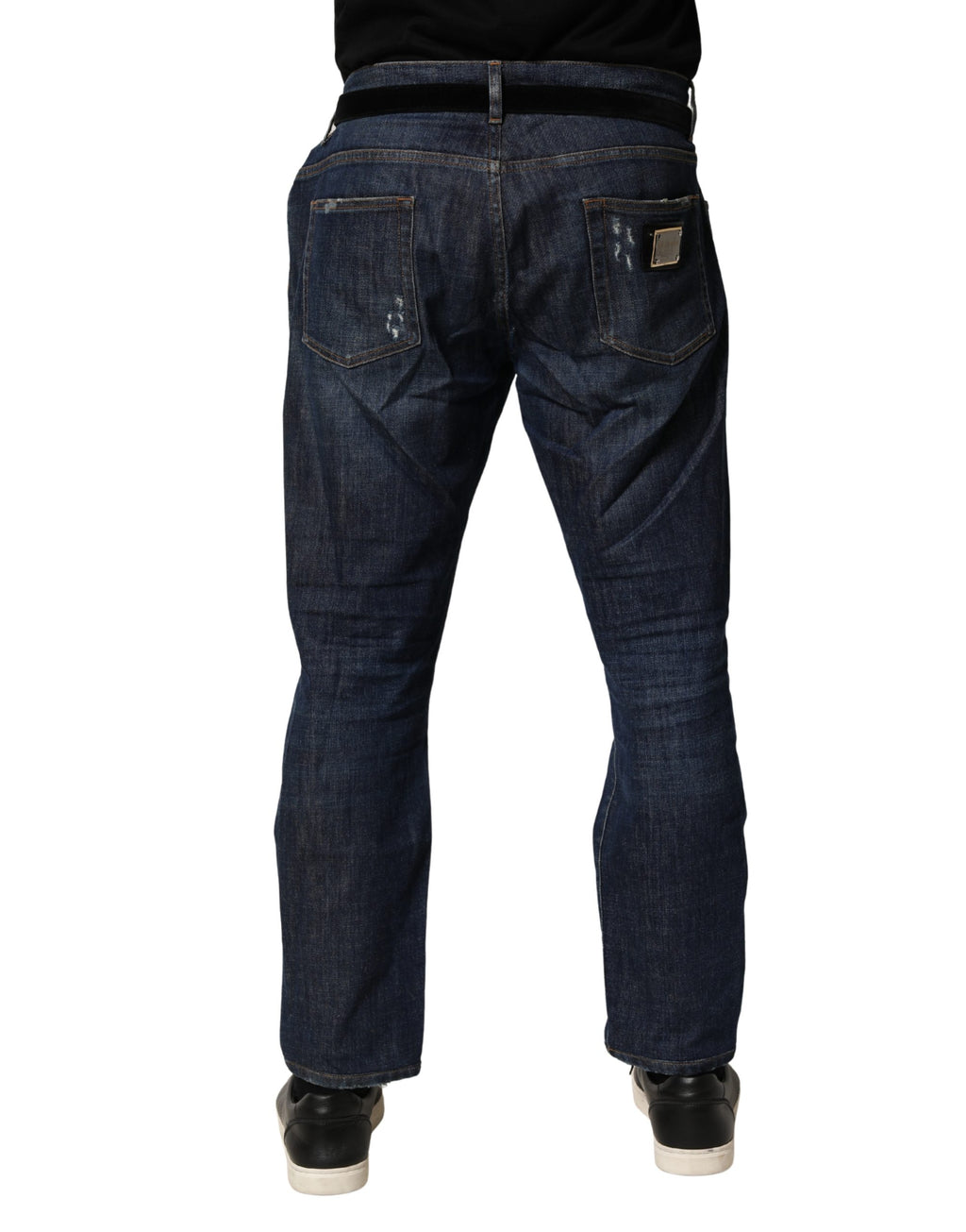 Jean slim en denim coton bleu foncé délavé de Dolce & Gabbana, coupe skinny, visible détails de lavages et coutures.