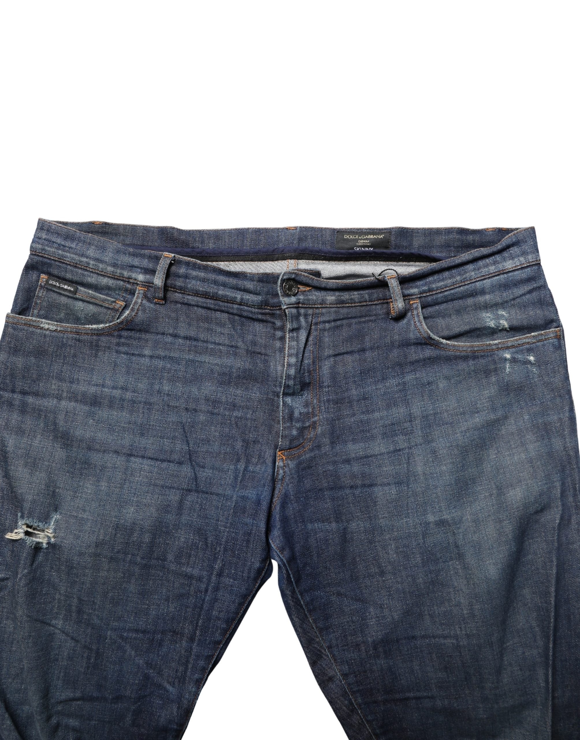 Jeans skinny en coton denim bleu foncé délavé de Dolce & Gabbana, coupe ajustée et détails classiques.