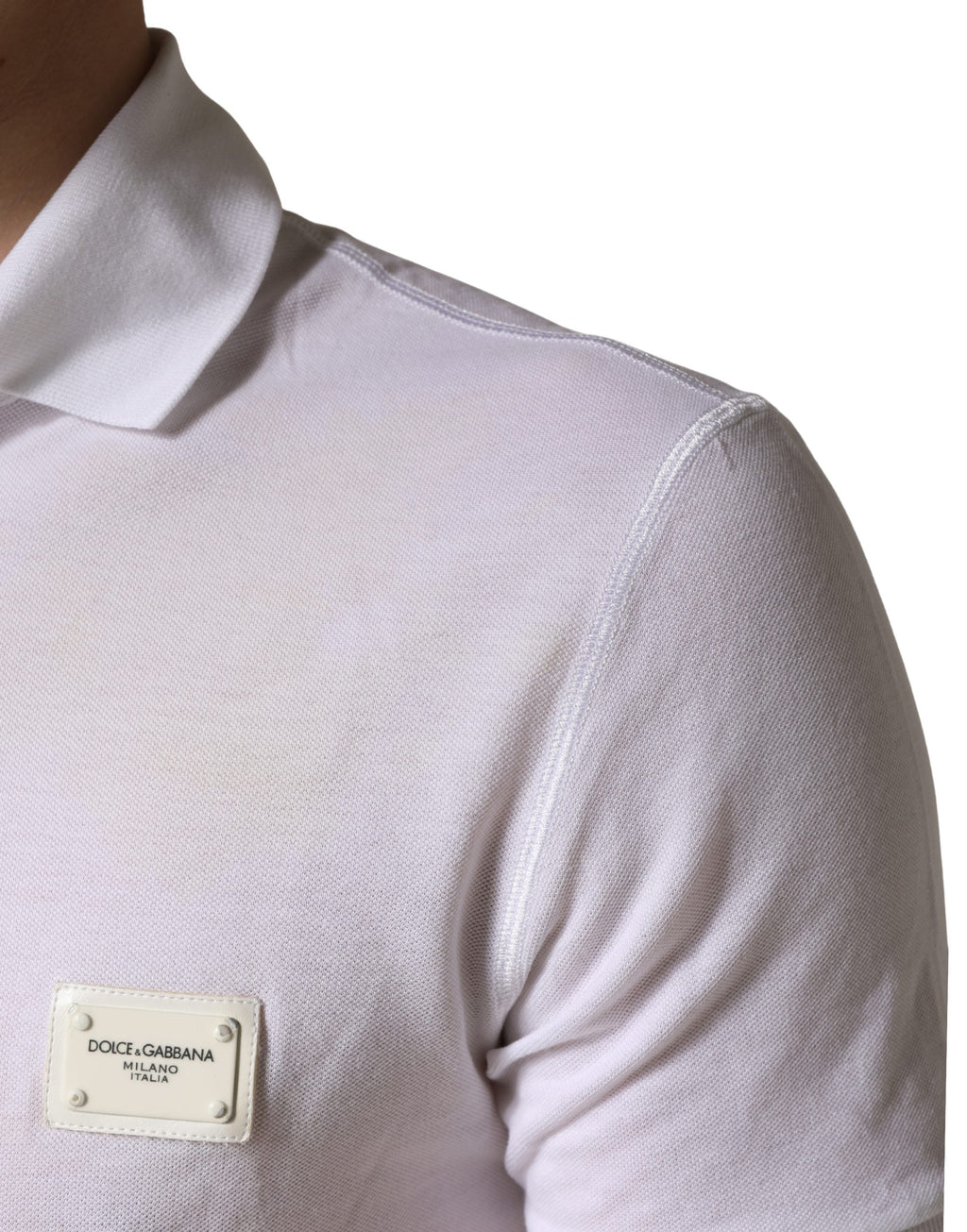 Polo homme Dolce & Gabbana blanc à col, manches courtes, tissu léger, style élégant et classique.