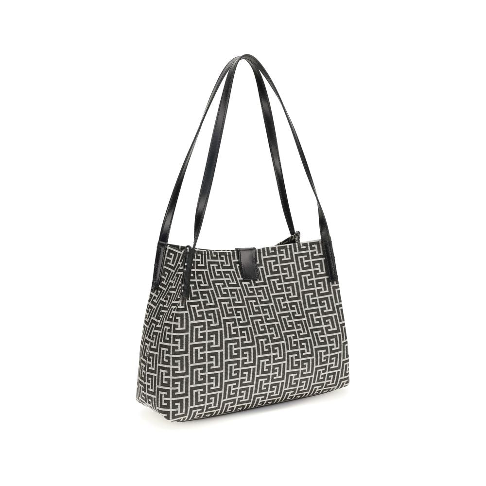 Sac à épaule en coton noir de Balmain, avec détails élégants et design sophistiqué, visible dans l'image.