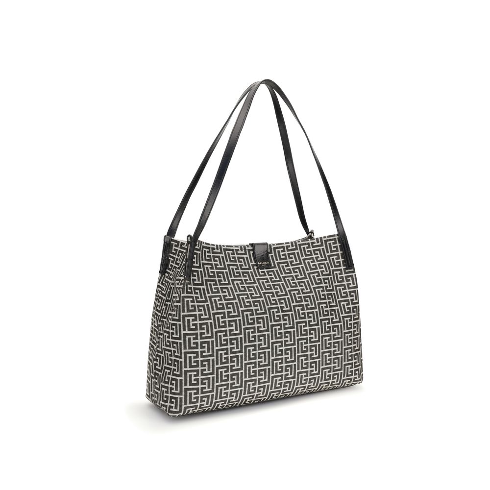 Sac à épaule noir en coton de la marque Balmain, avec détails élégants et design sophistiqué.