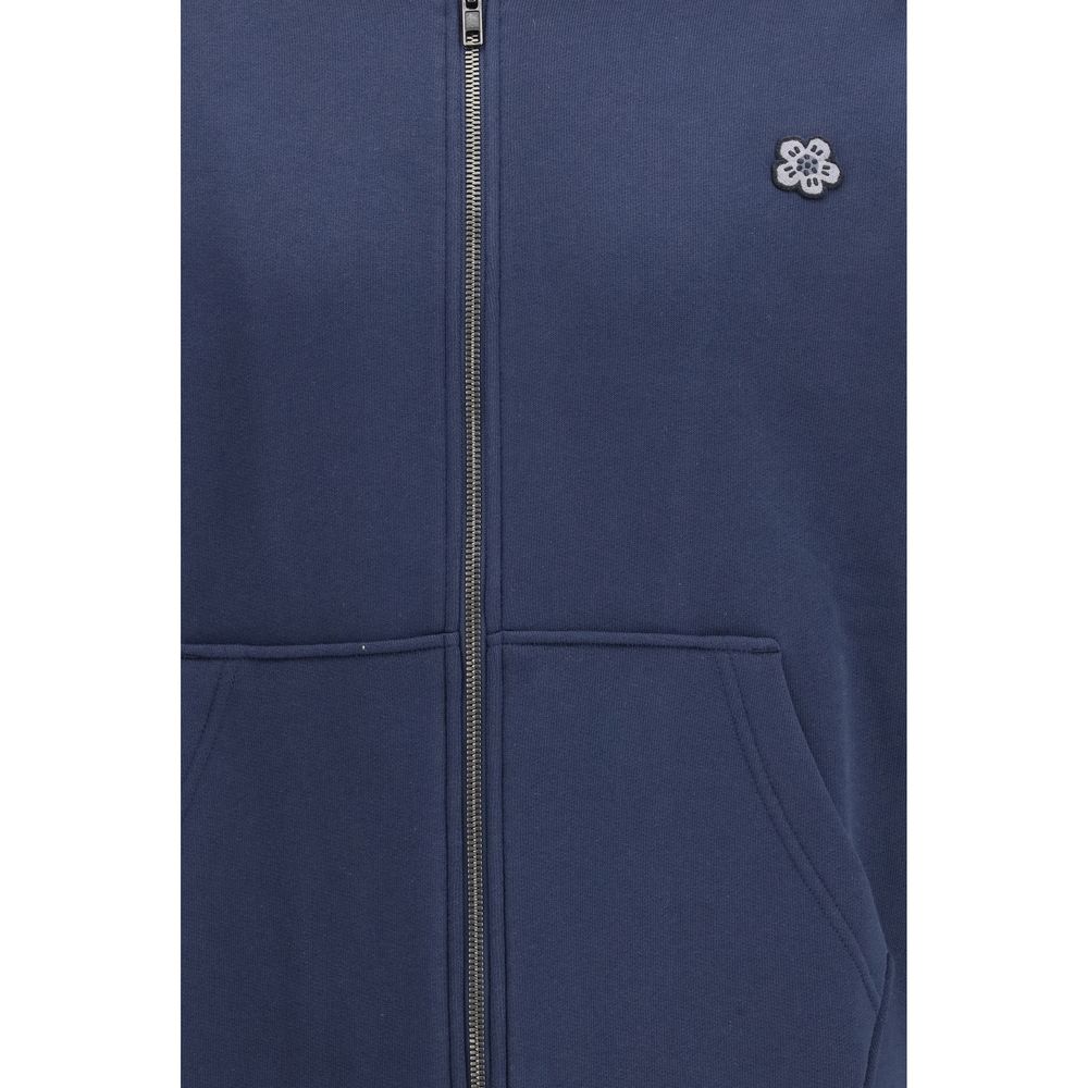Sweat-shirt en coton bleu de la marque Kenzo, coupe décontractée avec logo Kenzo visible sur la poitrine.