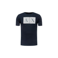 T-shirt en coton bleu Armani Exchange, coupe classique, porté sur un mannequin, vue de face.