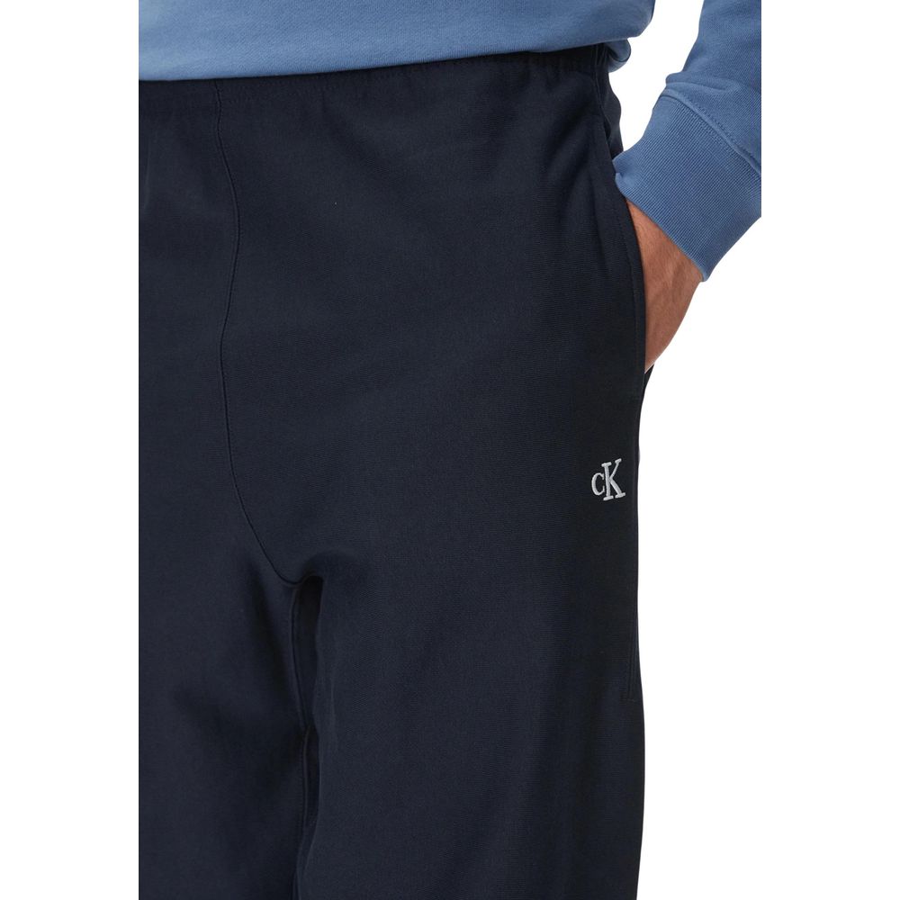 Pantalons de sport en coton bleu Calvin Klein Jeans, joggers pour l'entraînement, avec taille élastique et poches latérales.