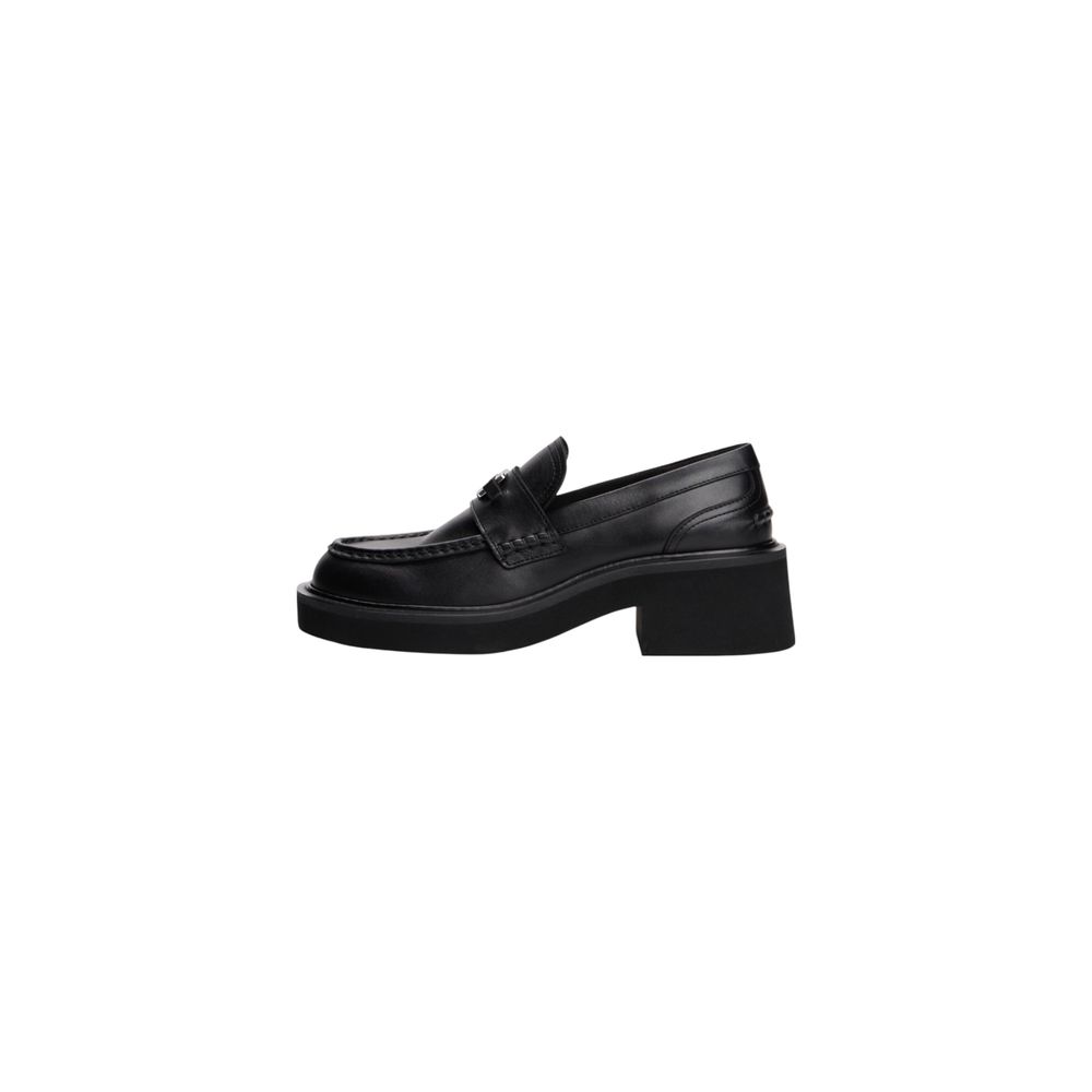 Escarpins en cuir noir Tommy Hilfiger Jeans avec talons hauts et design élégant, visibles dans l'image.