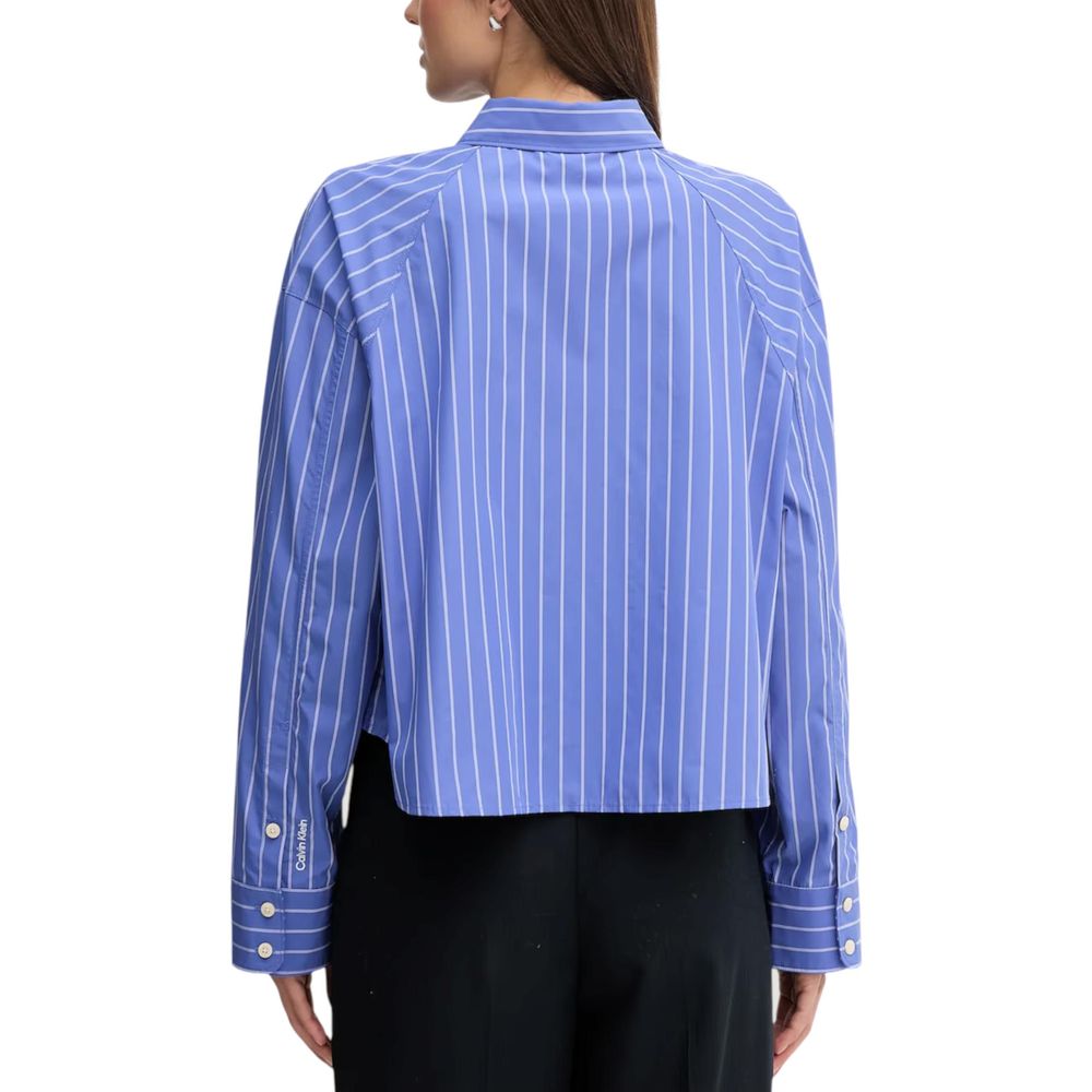 Chemise en coton bleu de Calvin Klein Jeans, vue de face, avec col et manches longues, style décontracté et moderne.
