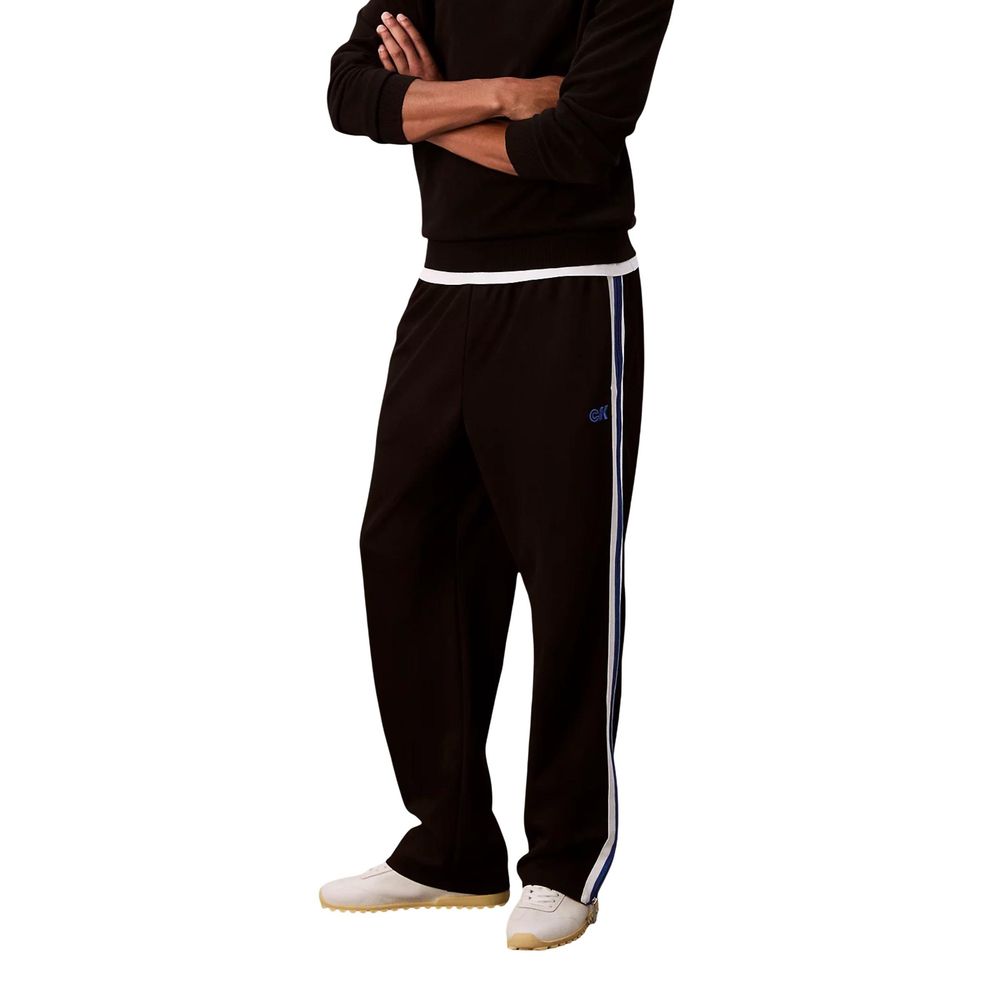 Pantalons de jogging en polyester noir de Calvin Klein Jeans, style décontracté pour l'entraînement ou le loisirs.