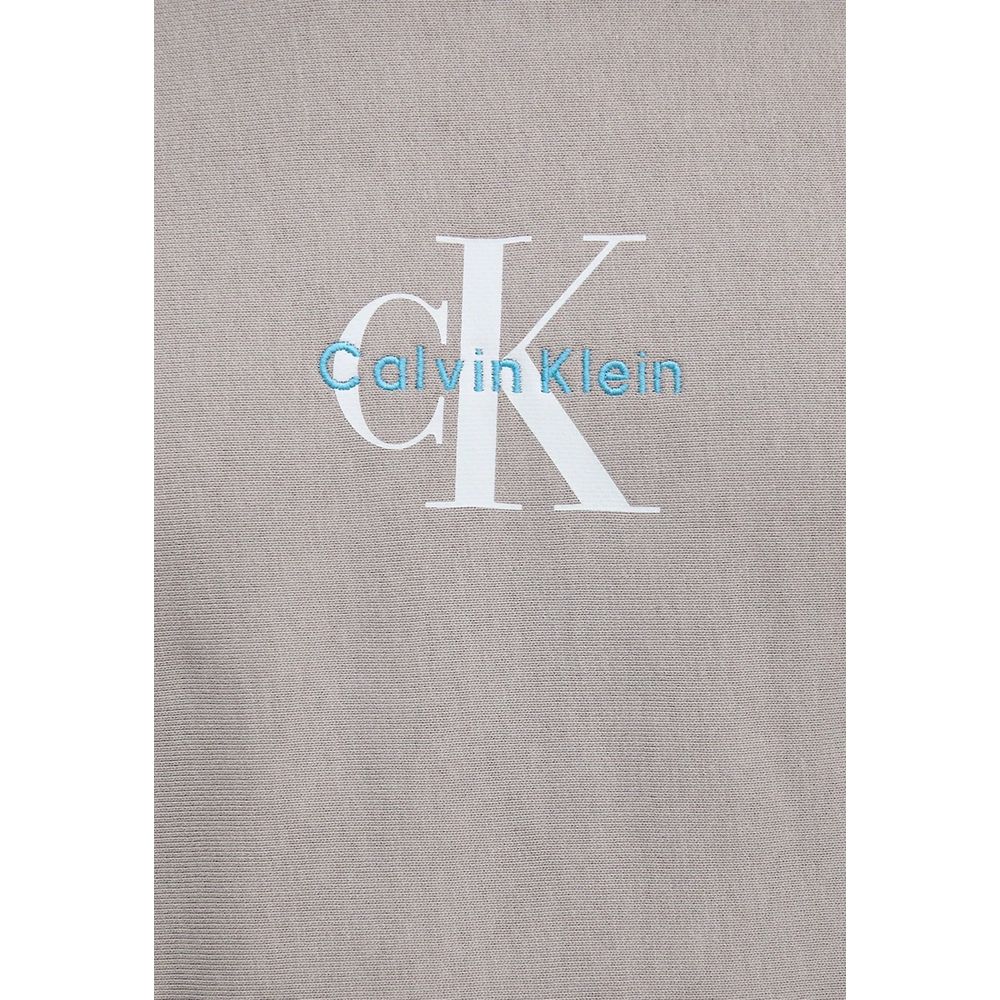 Sweat à capuche en coton gris de Calvin Klein Jeans, tissu doux et confortable, logo brodé sur la poitrine.