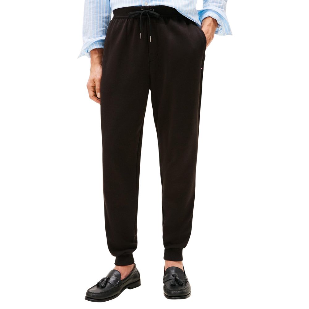 Pantalons de jogging en coton noir Tommy Hilfiger pour entraînement, coupe décontractée avec logo sur la jambe.