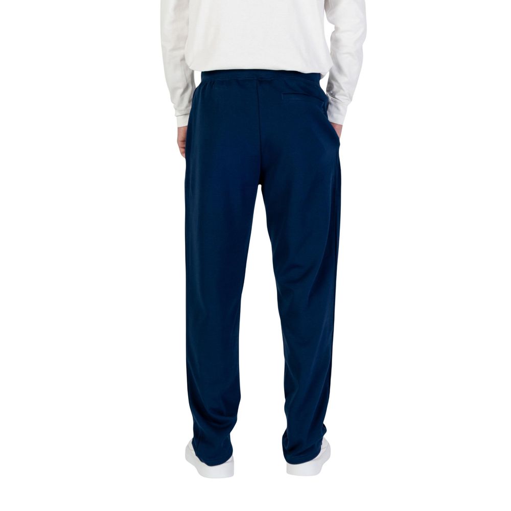 Pantalons de jogging Tommy Hilfiger en coton recyclé bleu, vêtements de sport confortables pour homme.