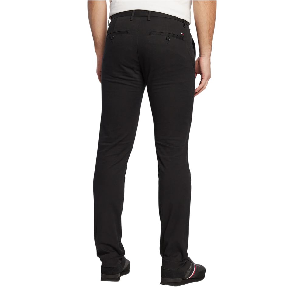 Pantalon skinny en coton recyclé noir de Tommy Hilfiger, vue de face sur un fond neutre.