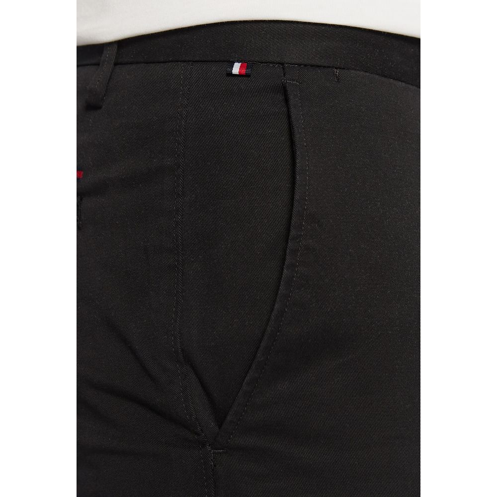 Pantalons skinny en coton recyclé noir Tommy Hilfiger, vue de face, avec ceinture et détails modernes.