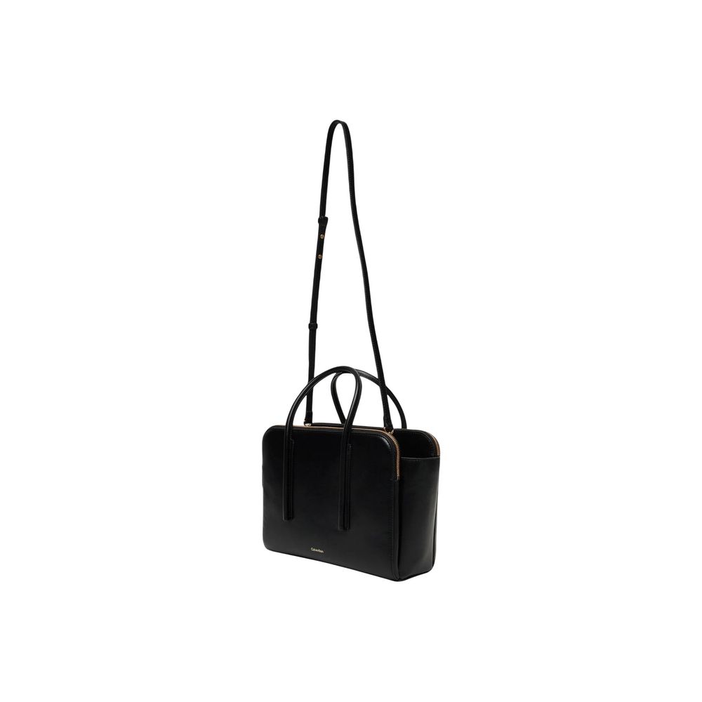 Sac à main en cuir noir de Calvin Klein avec poignées et détails élégants, vue de face.
