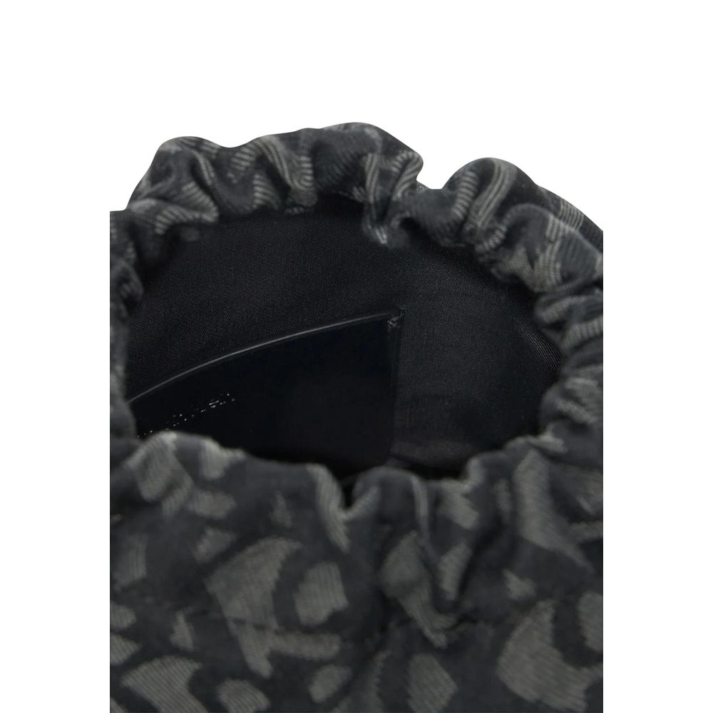 Sac à main Calvin Klein en polyester recyclé noir, avec poignées et design épuré visible sur l'image.