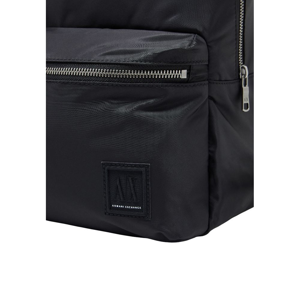 Sac à dos noir en polyamide de la marque Armani Exchange, avec compartiments et design moderne visible sur l'image.