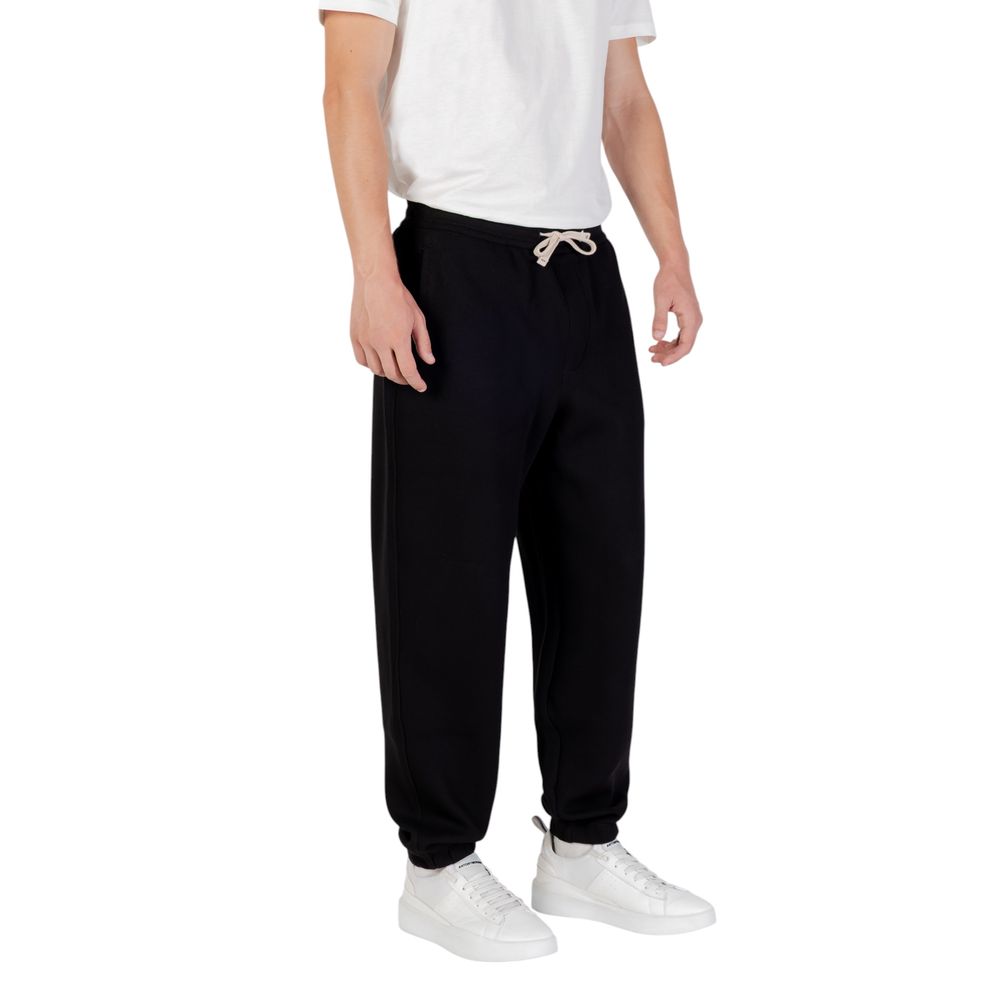 Pantalons de jogging en coton noir Armani Exchange pour homme, style décontracté et confortable pour l'entraînement ou la détente.
