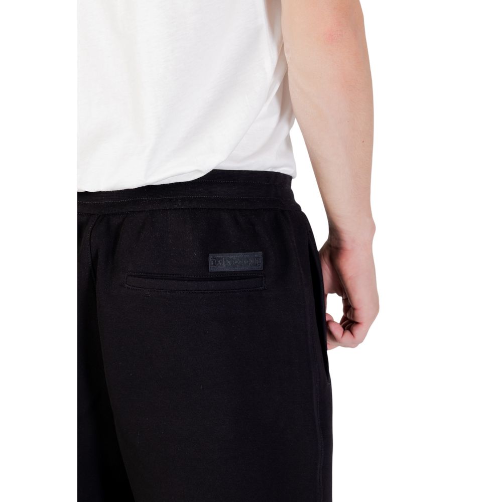 Pantalons de jogging en coton noir Armani Exchange pour homme, style décontracté et confortable, idéal pour l'entraînement.