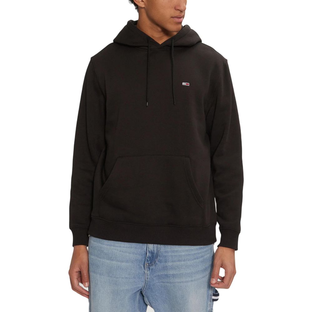 Hoodie noir en coton Tommy Hilfiger Jeans avec logo brodé, manches longues et coupe décontractée visible sur l’image.