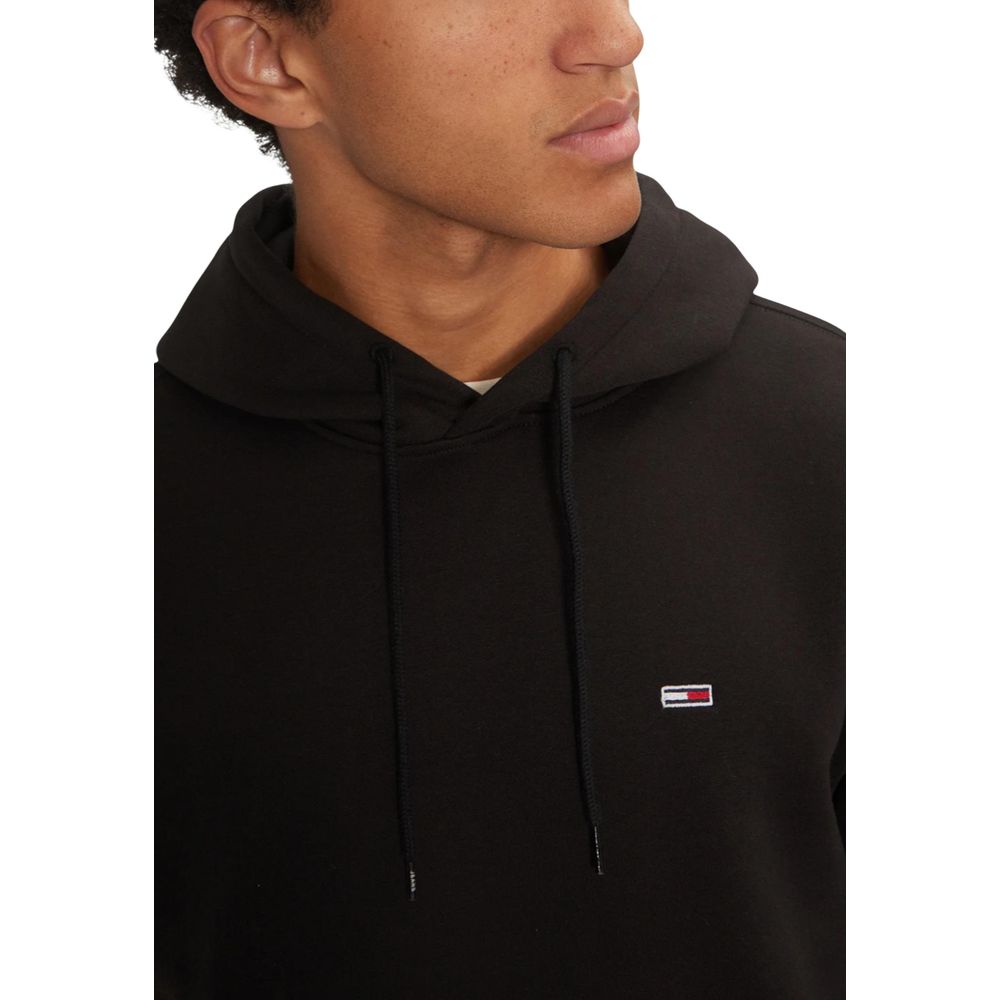 Sweat à capuche Tommy Hilfiger Jeans noir en coton, vue de face avec logo sur la poitrine et manches longues.