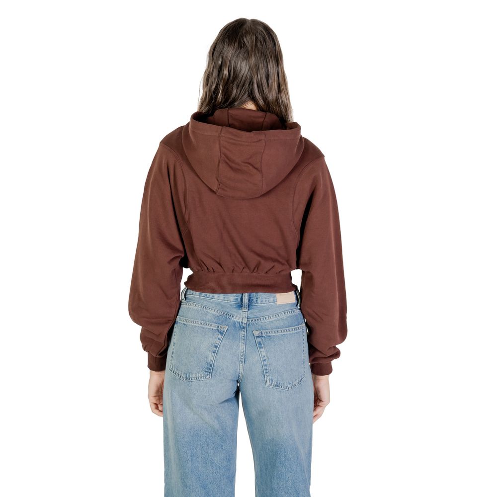 Hoodie en coton recyclé marron de Tommy Hilfiger Jeans, avec capuche et logo visible sur le devant.