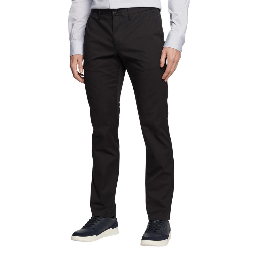 Pantalons décontractés recyclés en coton noir de Tommy Hilfiger, mode confortable et élégante pour un style casual.
