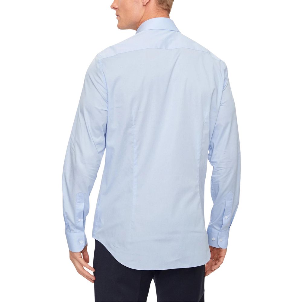 Chemise pour homme Tommy Hilfiger en coton biologique bleu, col boutonné et manches longues, élégante et confortable.