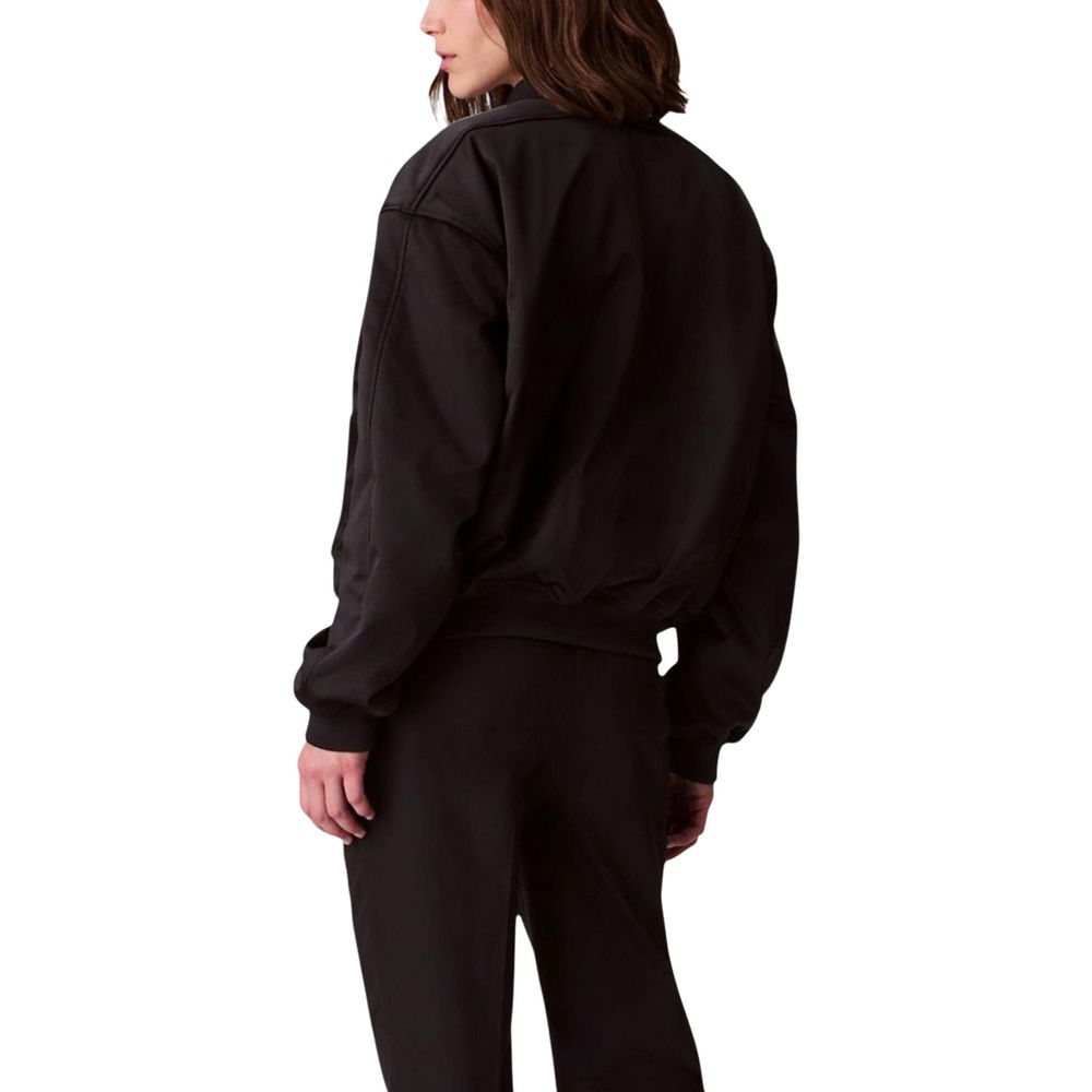 Veste bomber noire de Calvin Klein Jeans en polyester recyclé, avec col côtelé et fermeture éclair.