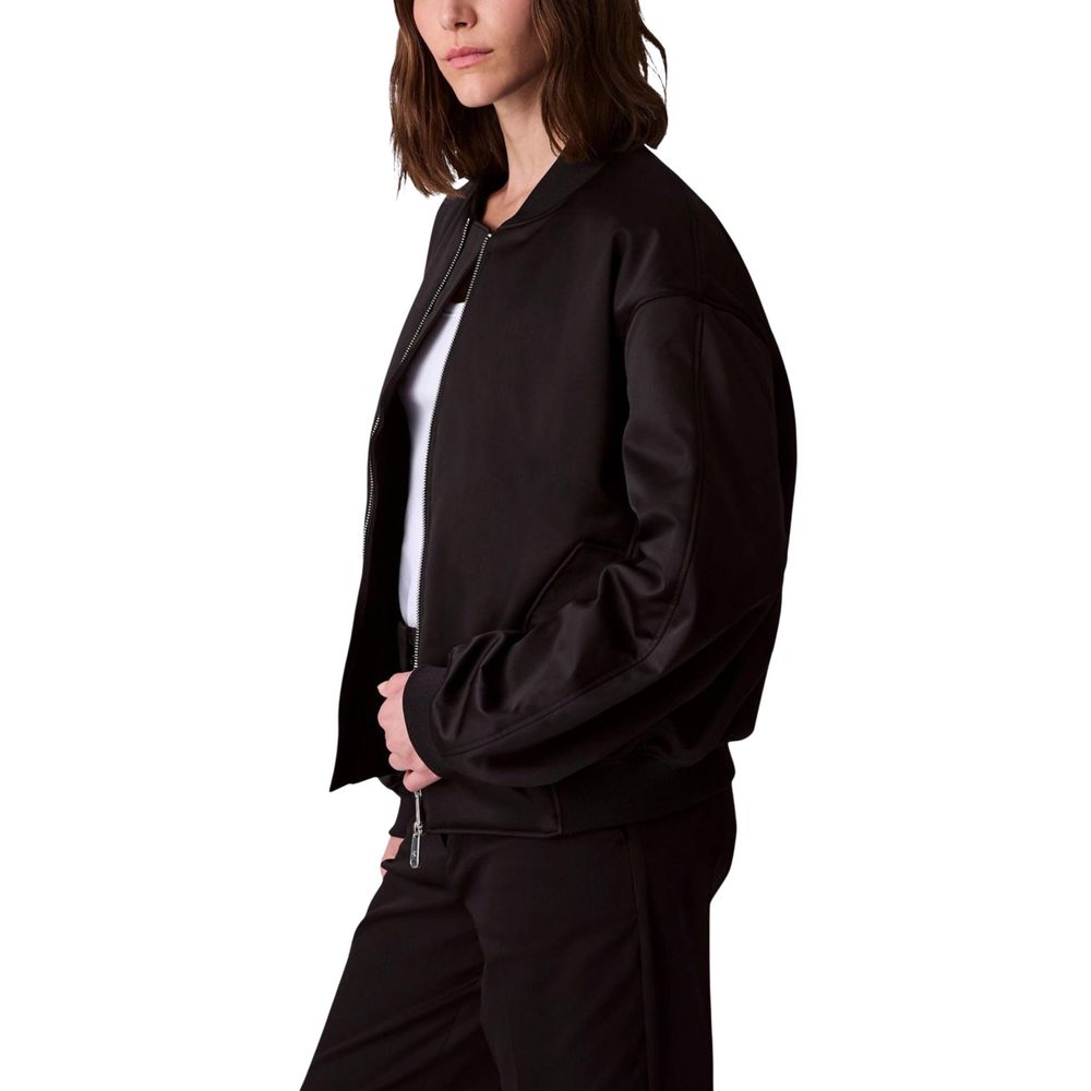 Veste bomber noire en polyester recyclé de Calvin Klein Jeans, coupe classique avec col montant et poignets élastiques.
