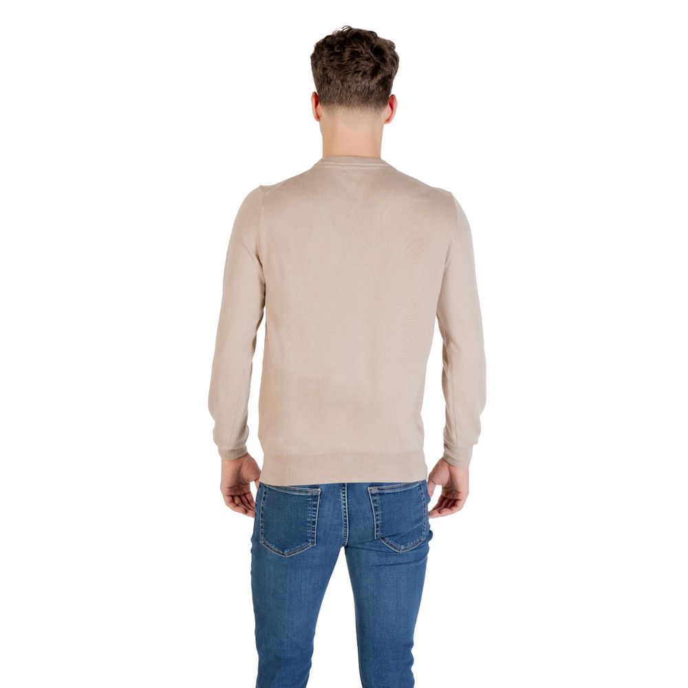 Sweatshirt en polyester beige de Guess, style décontracté, avec col rond et manches longues, vue de face.