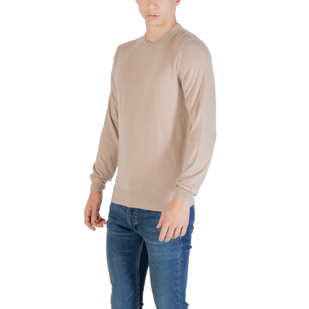 Sweat-shirt en polyester beige de Guess, coupe décontractée, porté avec col rond et manches longues, image affichée.