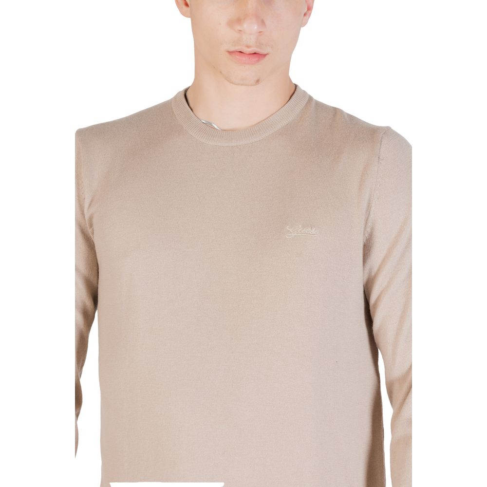 Sweat-shirt beige en polyester de la marque Guess, vue de face, avec col rond et manches longues.