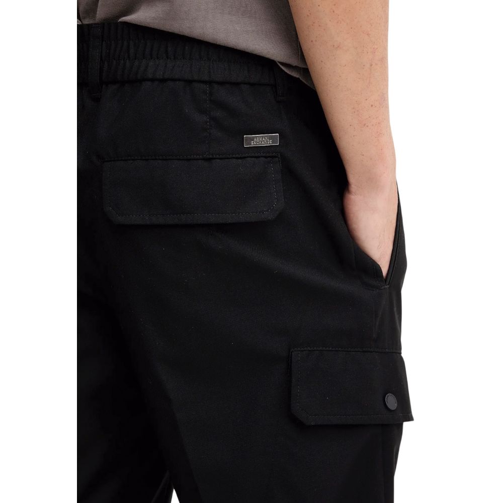 Pantalon décontracté en polyester noir Armani Exchange, vue de face, avec ceinture et poches visibles.