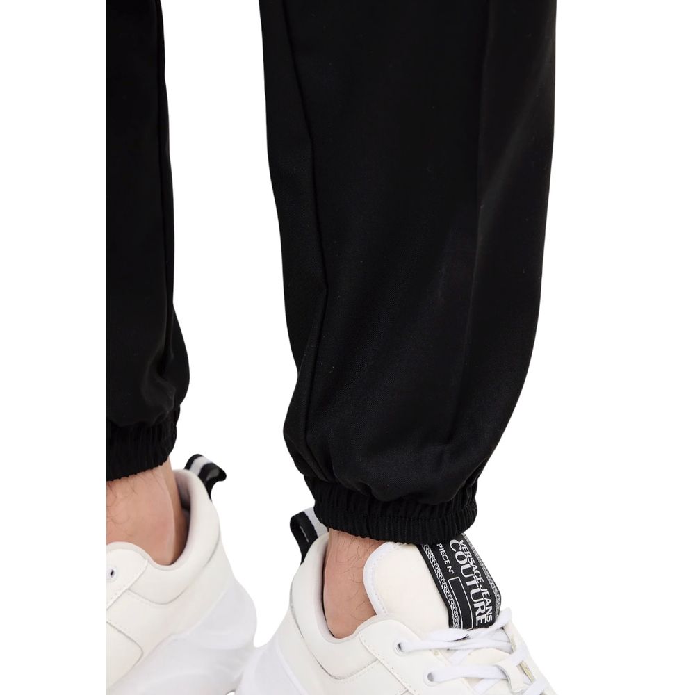 Pantalon décontracté en polyester noir de la marque Armani Exchange, style casual avec coupe ajustée.