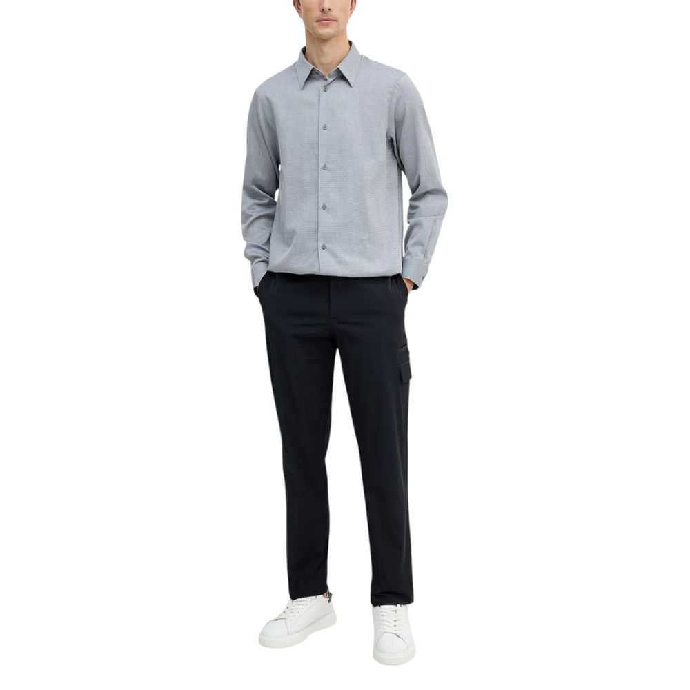 Chemise homme Armani Exchange en coton noir et blanc, élégante avec col classique et boutons visibles.
