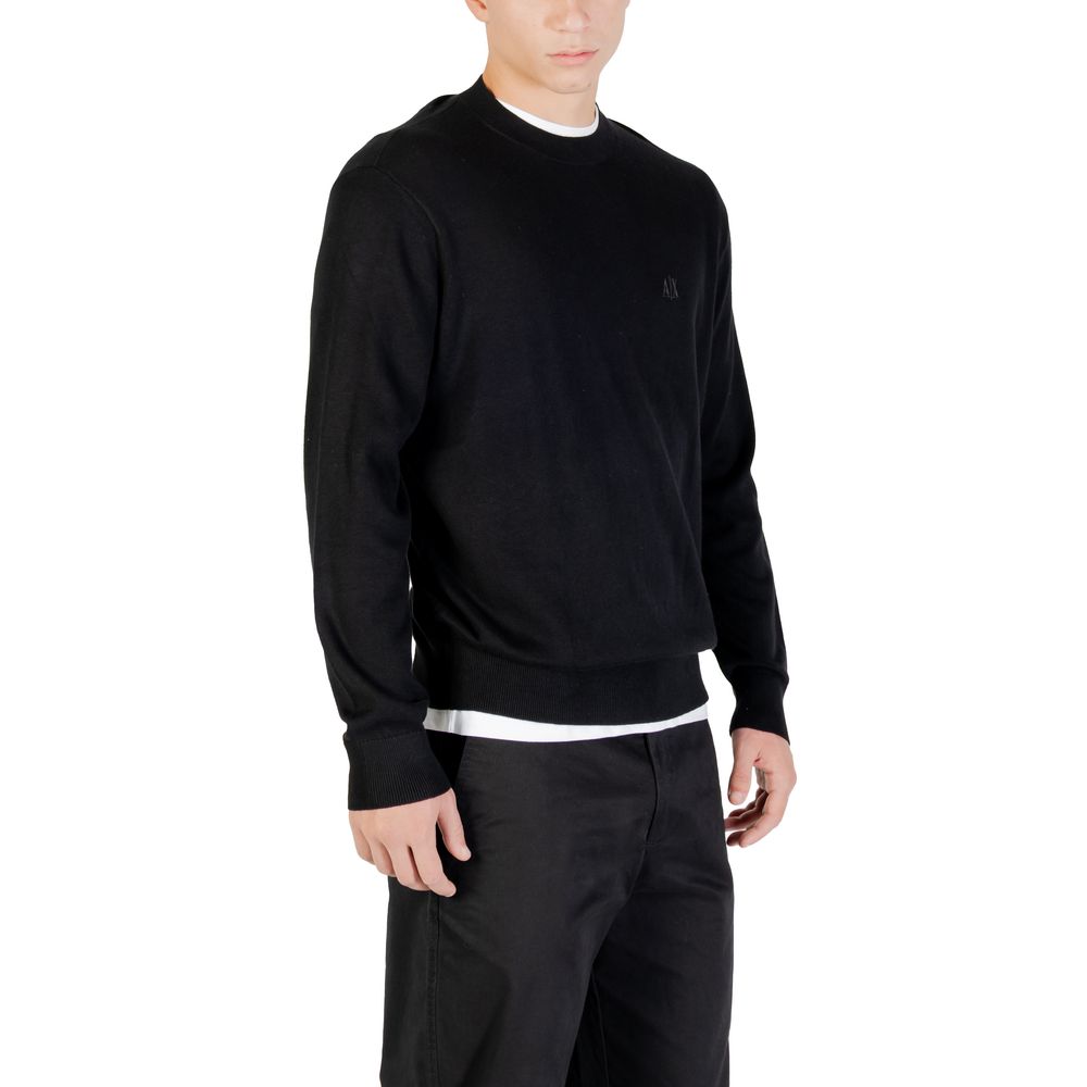 Sweatshirt noire en viscose Armani Exchange, vue de face, avec logo discret sur la poitrine.