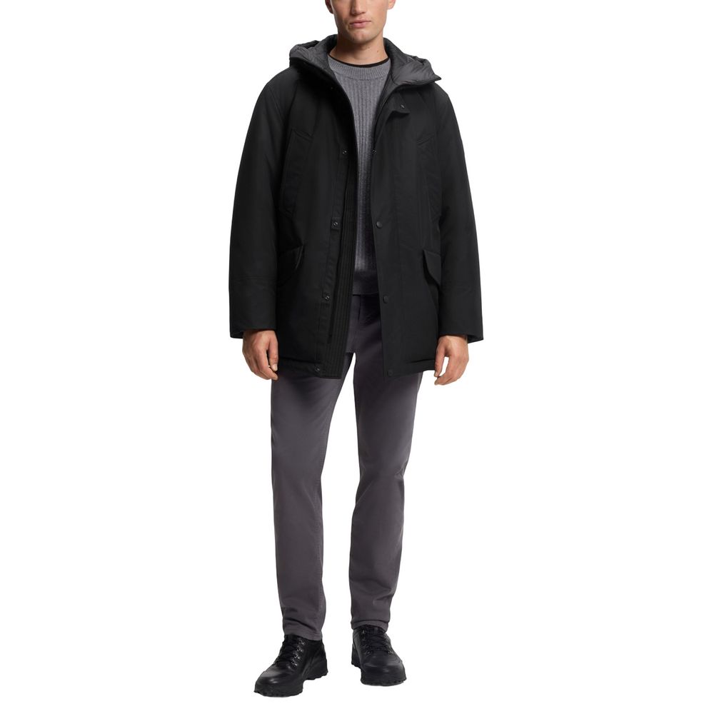 Veste longue en polyester noire de Hugo Boss, style élégant, avec détails de finition visibles sur l'image.