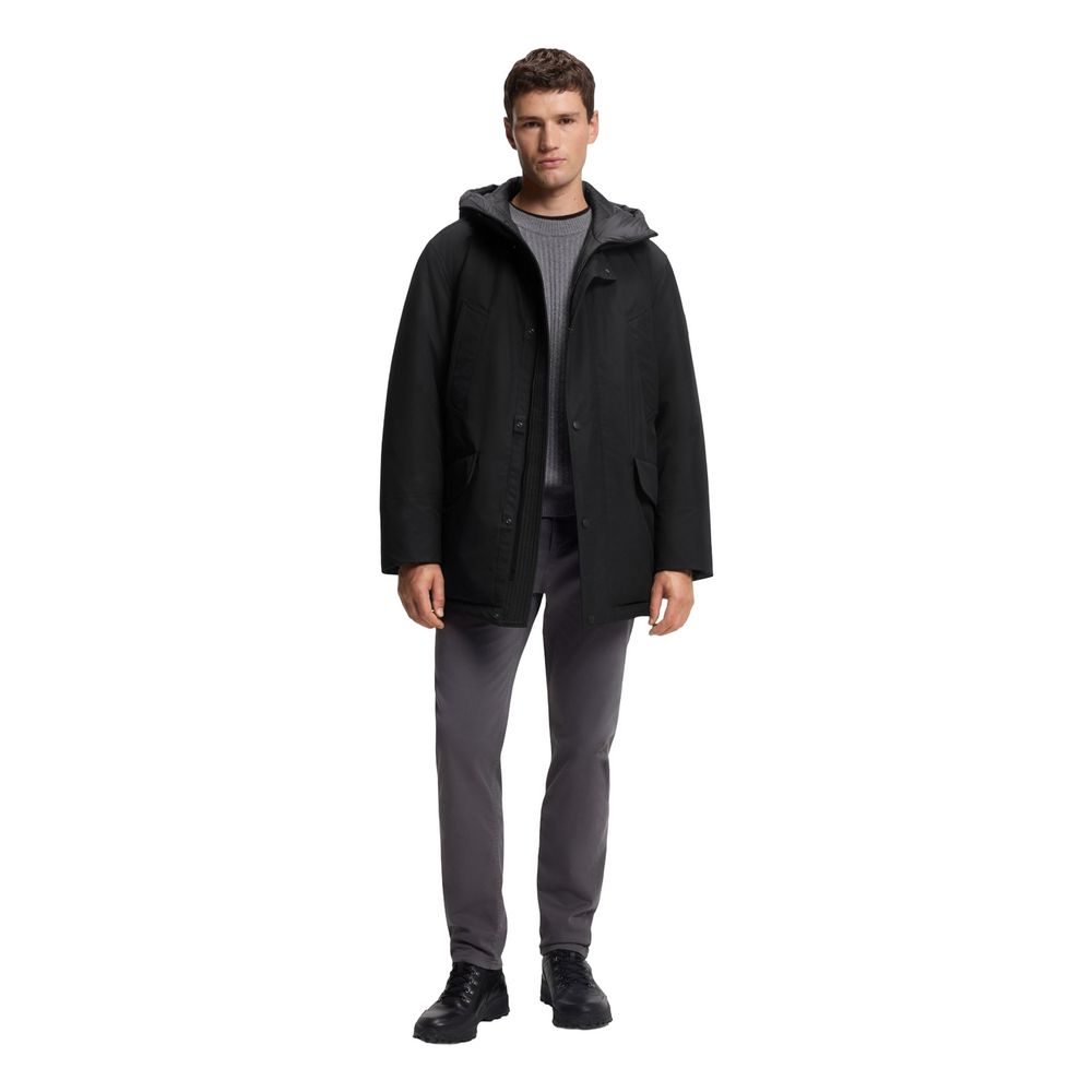 Veste longue en polyester noir de la marque Hugo Boss, coupe élégante et moderne, vue de face sur fond neutre.