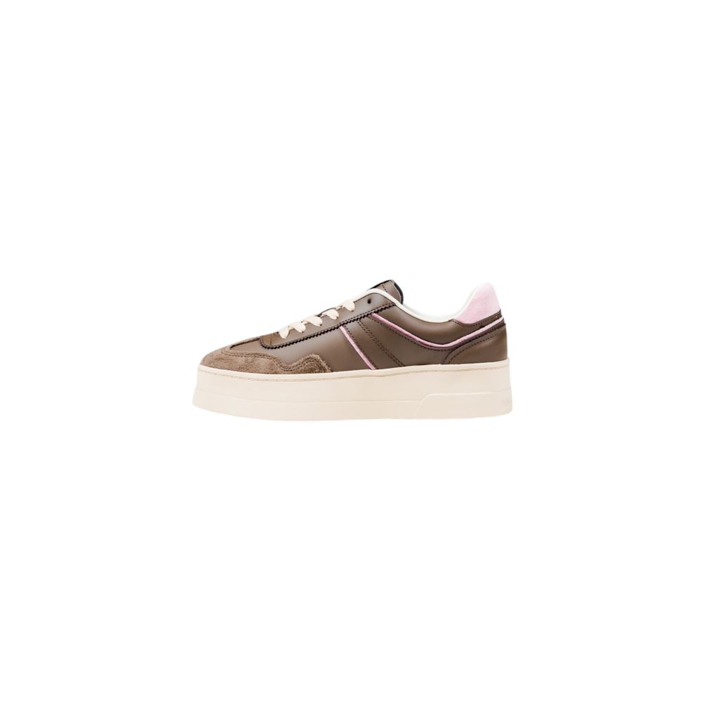 Sneakers en cuir artificiel marron Tommy Hilfiger Jeans, style décontracté avec semelle blanche et design moderne.