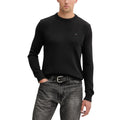 Pull noir en coton bio de Tommy Hilfiger Jeans, sweat-shirt décontracté, avec logo discret et coupe classique visible dessus.