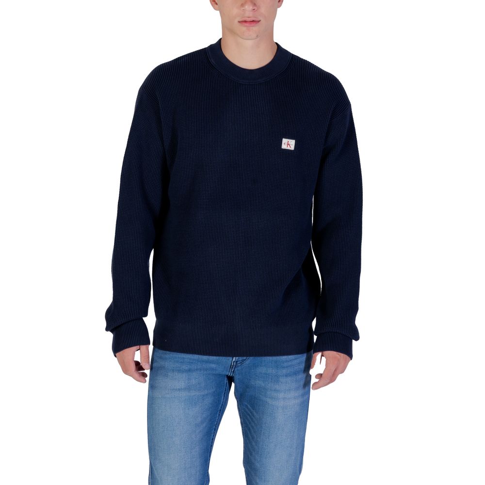 Sweat-shirt bleu en coton de Calvin Klein Jeans, col rond, manches longues, style décontracté et confortable.