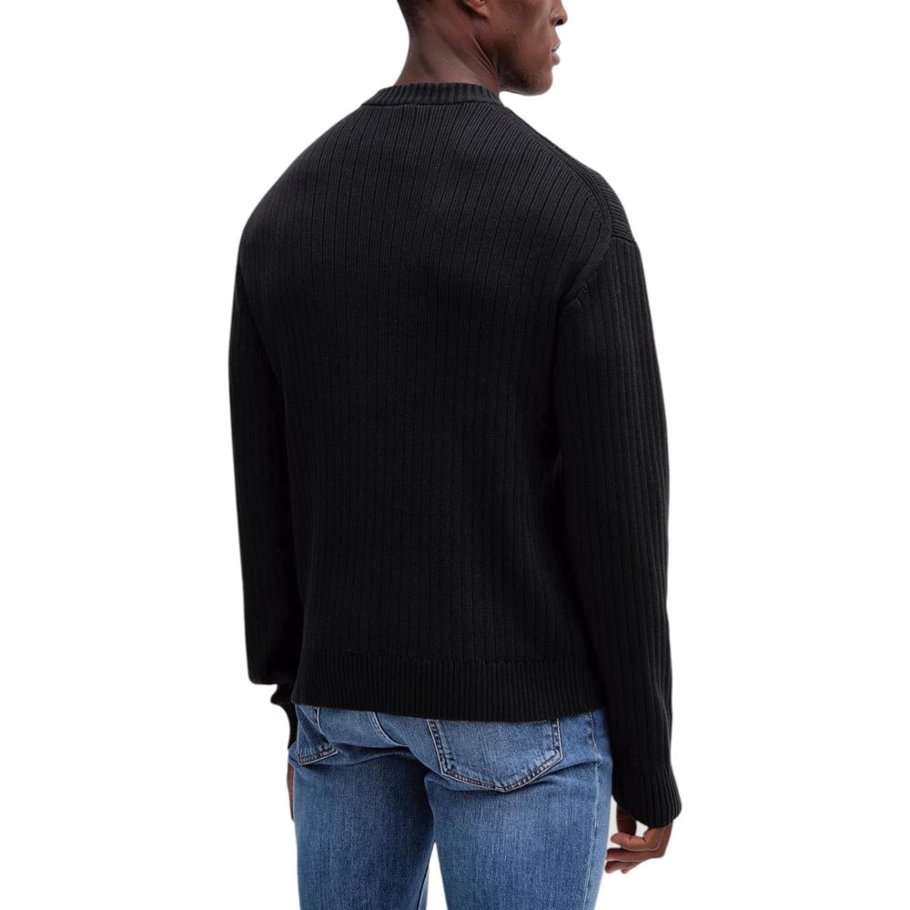 Sweatshirt noir en coton de Calvin Klein Jeans, coupe décontractée, avec logo discret sur la poitrine.